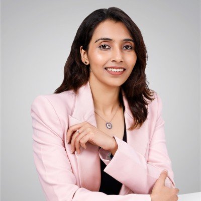 Portrait of Ishendra Agarwal, Founder and CEO of GIVA, in a grey suit against a light backdrop